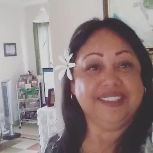 a woman with a flower in her hair