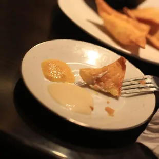 a plate of food and a fork on a table