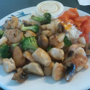 Chicken, Shirmp and broccoli, carrots, rice and shrimp sauce.