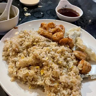 Hibachi shrimp and fried rice with steamed pork dumplings.