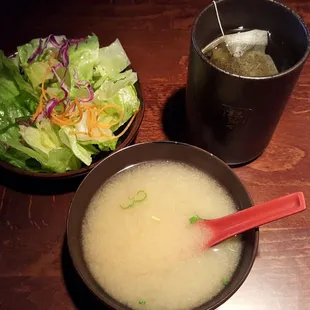a bowl of soup and a bowl of salad