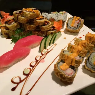 a platter of sushi and rolls