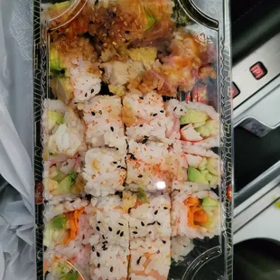 3 orders of Shushi jammed in to one container