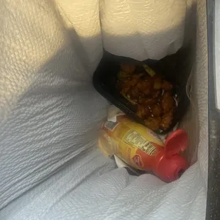 Orange chicken in the trash