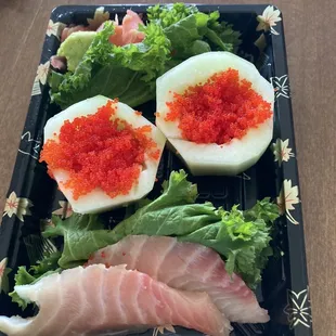 Red snapper sashimi and flying fish roe. They didn't give any rice though