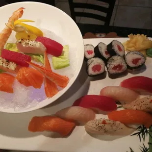 a plate of sushi and a bowl of shrimp