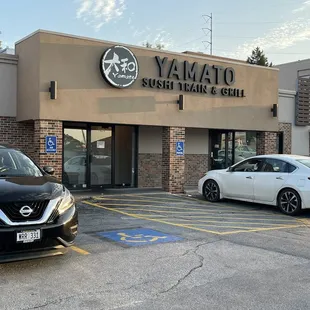 two cars parked in a parking lot