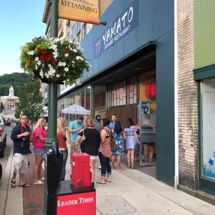 people walking on the sidewalk