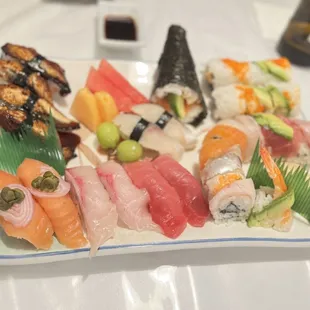 Beautiful presentation of various nigiri, rolls, &amp; a hand roll.