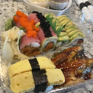 Eskimo Shrimp roll, Summer Dragon roll, unagi sashimi, and tamago sushi.