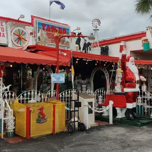 a santa claus statue in front of the restaurant