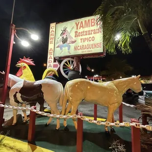 horses and roosters on display