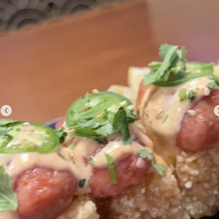 a close up view of a roll with a variety of toppings