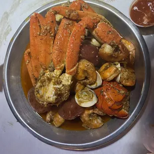 a plate of crab legs and clams