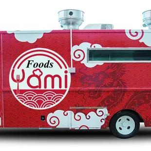a food truck with food on the side