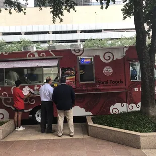 people ordering food from a food truck
