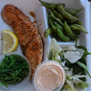 Salmon hibachi plate with seaweed salad and edamame