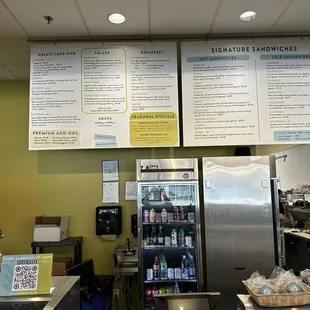 Another view of their menu with beverage cooler in the background