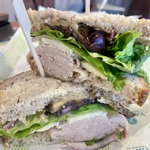 Create Your Own (Light rye, turkey, brie, kalamata olives, romaine lettuce, red onion, grilled eggplant, dijon mustard and red vinaigrette)
