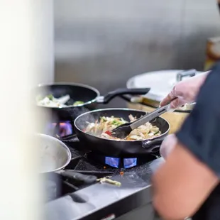 a man preparing food in a kitchen