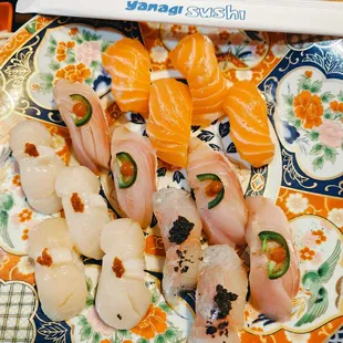 nigiri: salmon, yellowtail w/ jalapeno on top, giant Japanese scallop &amp; red snapper with truffle in top...thick cut and spectacular