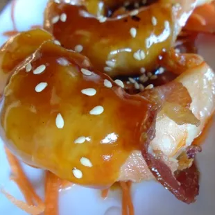 Bacon wrapped chicken skewers, close-up.