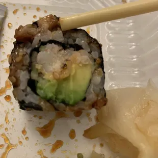 Manayunk Roll with eel piece next to chopstick