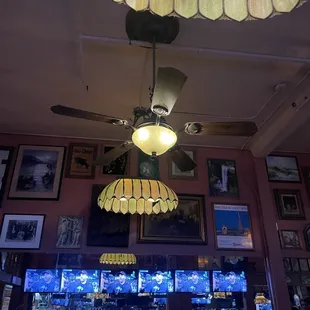a ceiling fan and a chandelier
