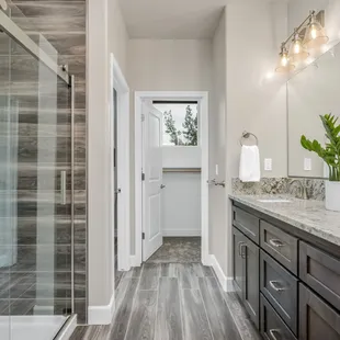 a spacious bathroom with a walk in shower