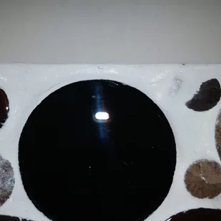 Tiles set uneven and covered with grout. Grout very uneven.