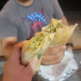 a man holding a taco