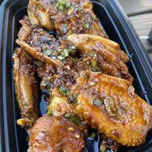 Crispy chicken wings in their Yang Chow special sauce. This is not on the main menu but on a paper by the register.