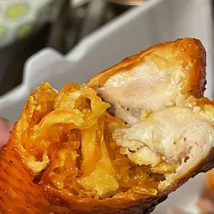 a person holding a piece of food