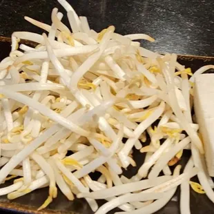 a pile of shredded white bean sprouts on a plate