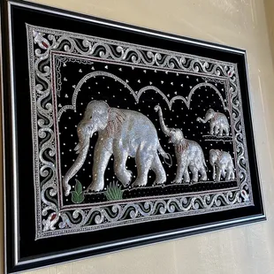 a picture of a family of elephants