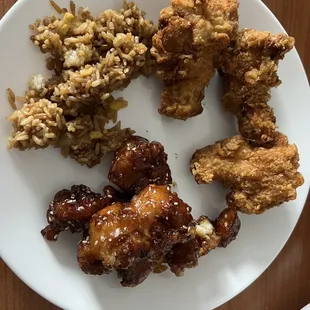a plate of fried chicken and rice
