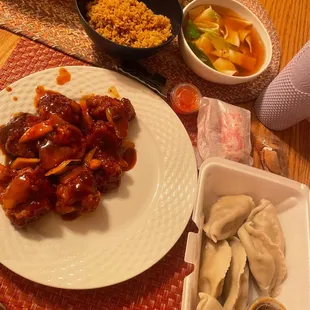 a plate of dumplings and a bowl of soup