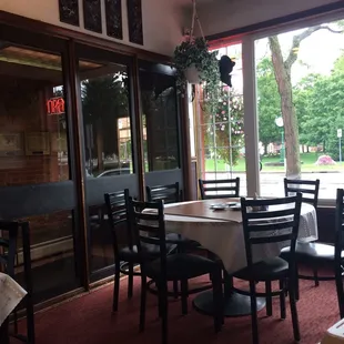 a dining area with tables and chairs