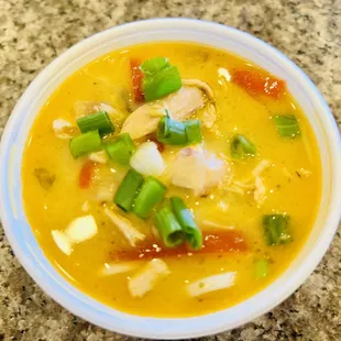 a bowl of soup on a granite countertop