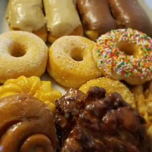 Chocolate/Maple bars, sugar, frosted w/sprinkles, old fashioned, buttermilk, curlers, apple fritters, cinnamon rolls.