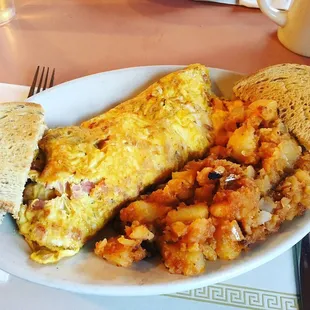 Ham and cheese omelet with mushrooms and home fries!