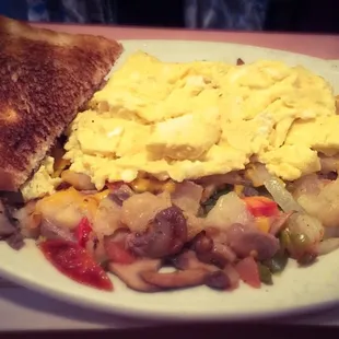 Veggie Skillet with scrambled eggs and white toast.