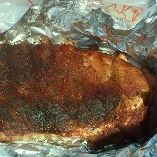 Half slab of ribs sauce on the side! Unbelievable!