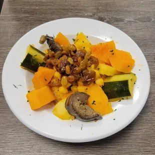 a plate of squash, zucchini, and mushrooms