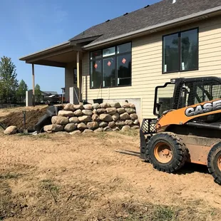 a small ski - loader parked in front of a house