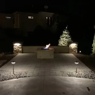 a fire pit lit up at night