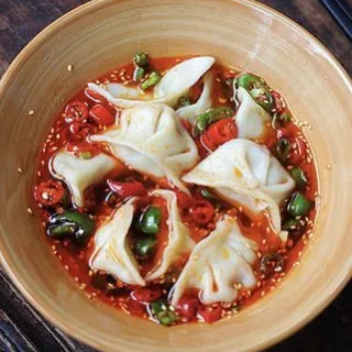 A6. Dumplings with Spicy Snail Soup 8-12pc