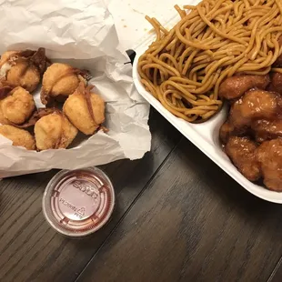 Orange chicken with noodles and crab wontons.