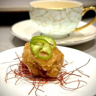 a plate of food and a cup of tea