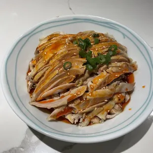 a plate of food with meat and vegetables